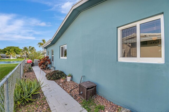 11520 NW 23rd St, Pembroke Pines, FL 33026 - view of property exterior featuring stucco siding and a water view