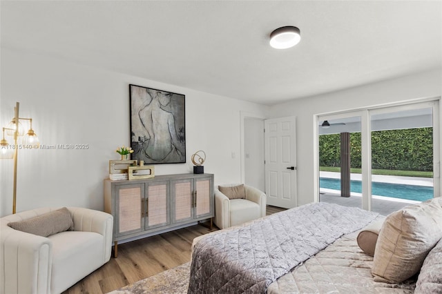 1365 SW 14th St, Boca Raton, FL 33486 - bedroom featuring access to exterior and wood finished floors