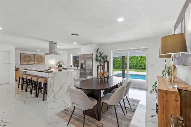 1365 SW 14th St, Boca Raton, FL 33486 - dining area with light marble finish floors, recessed lighting, and a textured ceiling