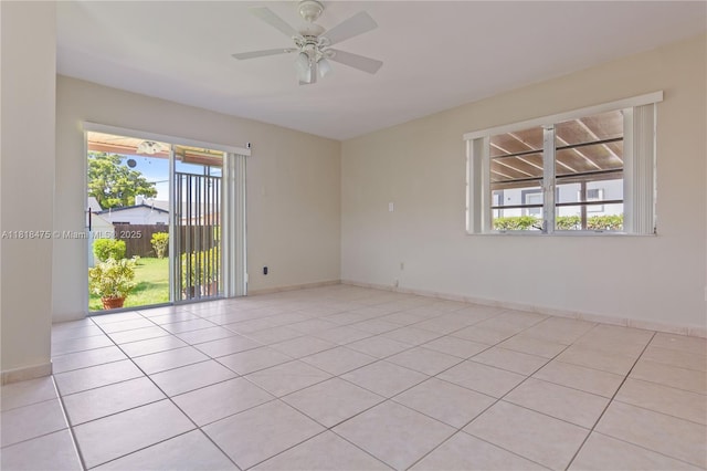 3685 SW 26th St, Miami, FL 33133 - empty room with healthy amount of natural light, a ceiling fan, and light tile patterned floors