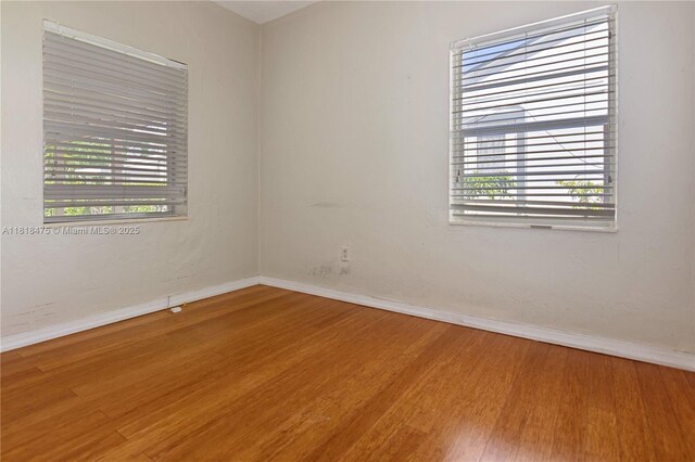 3685 SW 26th St, Miami, FL 33133 - unfurnished room featuring wood finished floors and baseboards