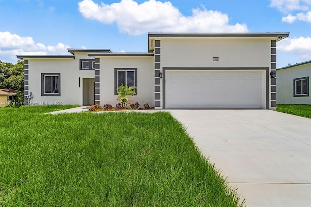 3512 2nd St W, Lehigh Acres, FL 33971 - view of front of property featuring stucco siding, a front lawn, driveway, and a garage