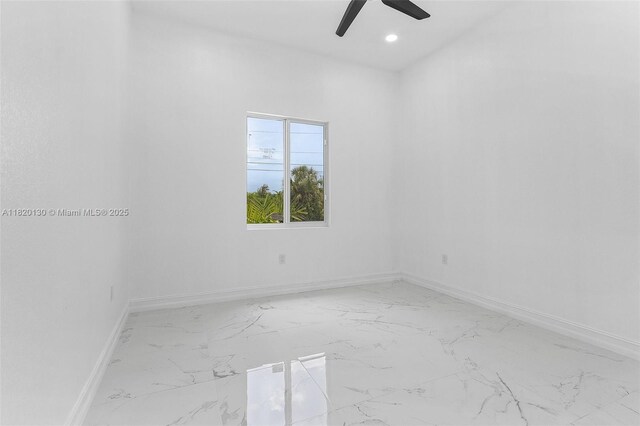 3512 2nd St W, Lehigh Acres, FL 33971 - spare room with light marble finish flooring, ceiling fan, and recessed lighting