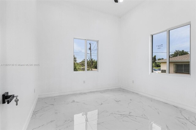 3512 2nd St W, Lehigh Acres, FL 33971 - spare room with marble finish flooring