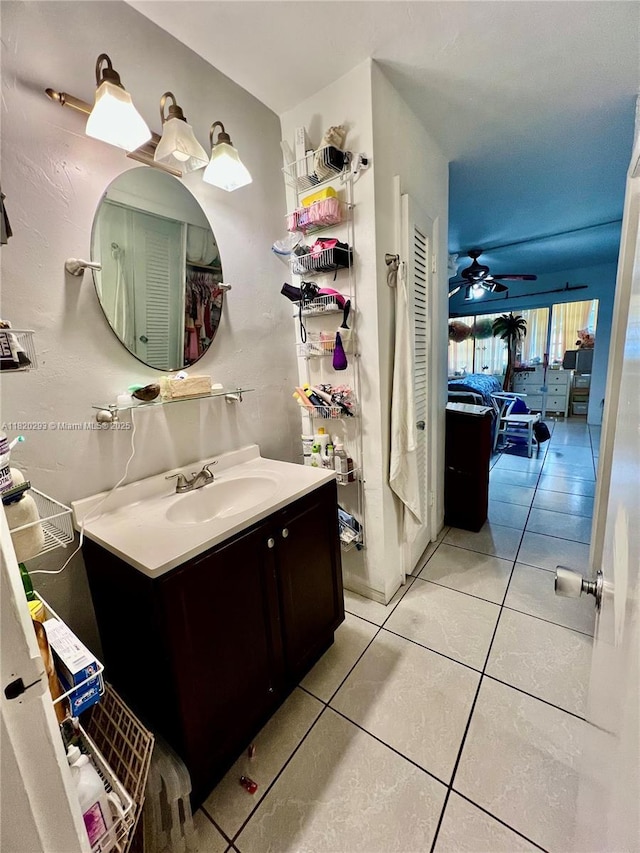 1540 NE 191st St Unit 140, Miami, FL 33179 - bathroom featuring vanity, tile patterned flooring, and ceiling fan