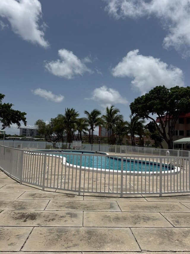 1540 NE 191st St Unit 140, Miami, FL 33179 - bedroom featuring tile patterned floors