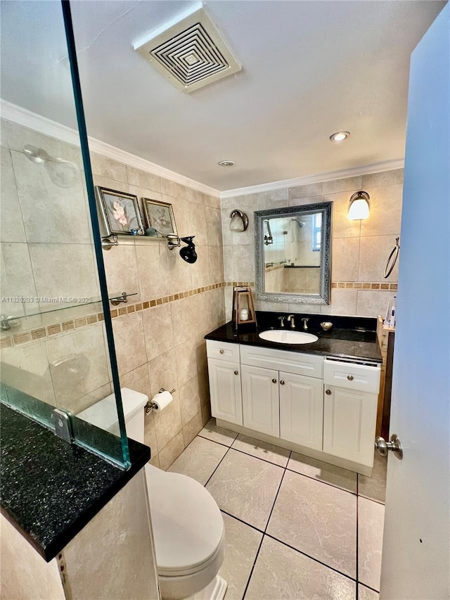 1540 NE 191st St Unit 140, Miami, FL 33179 - full bathroom with tile walls, crown molding, vanity, tile patterned floors, and a tile shower