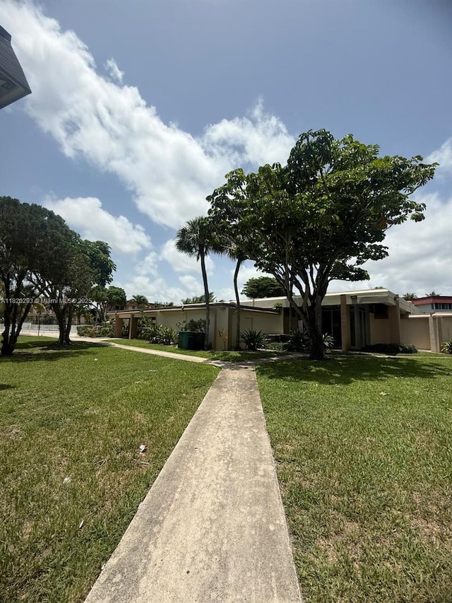 1540 NE 191st St Unit 140, Miami, FL 33179 - view of front of home with a front yard