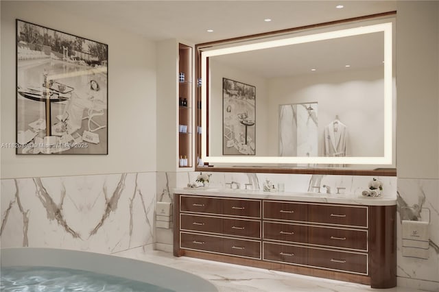 1420 S Miami Ave Unit 5304, Miami, FL 33130 - bathroom with double vanity, marble finish flooring, tile walls, a tub, and a wainscoted wall