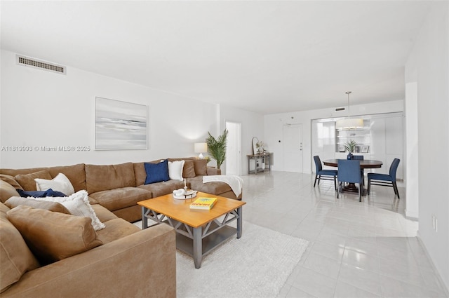 10185 Collins Ave Unit 1508, Bal Harbour, FL 33154 - living area with light tile patterned floors and baseboards