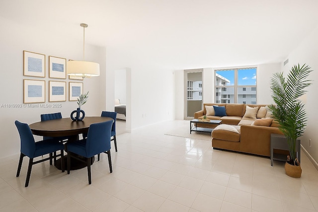 10185 Collins Ave Unit 1508, Bal Harbour, FL 33154 - dining area featuring baseboards and light tile patterned floors