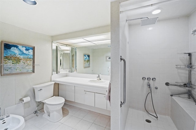 10185 Collins Ave Unit 1508, Bal Harbour, FL 33154 - bathroom featuring tiled shower, vanity, a bidet, and tile patterned flooring