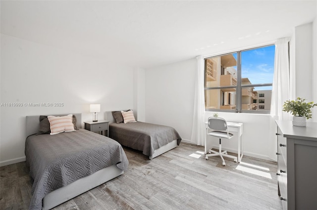10185 Collins Ave Unit 1508, Bal Harbour, FL 33154 - bedroom with light wood-style flooring and baseboards