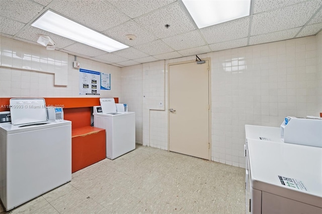 10185 Collins Ave Unit 1508, Bal Harbour, FL 33154 - community laundry with tile walls, washer and clothes dryer, and light flooring