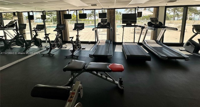 10185 Collins Ave Unit 1508, Bal Harbour, FL 33154 - workout area with a paneled ceiling and floor to ceiling windows