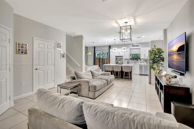 18410 NW 91st Ct, Hialeah, FL 33018 - living area featuring light tile patterned floors, stairs, a chandelier, and recessed lighting