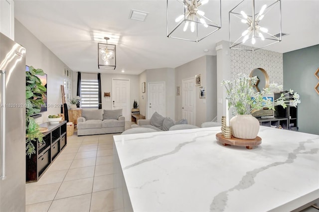 18410 NW 91st Ct, Hialeah, FL 33018 - dining space featuring light tile patterned flooring, a chandelier, and stairway