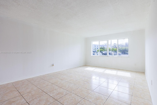 14850 Naranja Lakes Blvd Unit B1B, Homestead, FL 33032 - unfurnished room with light tile patterned flooring and a textured ceiling