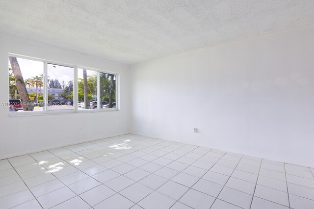14850 Naranja Lakes Blvd Unit B1B, Homestead, FL 33032 - unfurnished room featuring a textured ceiling and tile patterned flooring