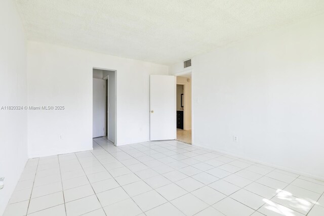 14850 Naranja Lakes Blvd Unit B1B, Homestead, FL 33032 - unfurnished room featuring a textured ceiling