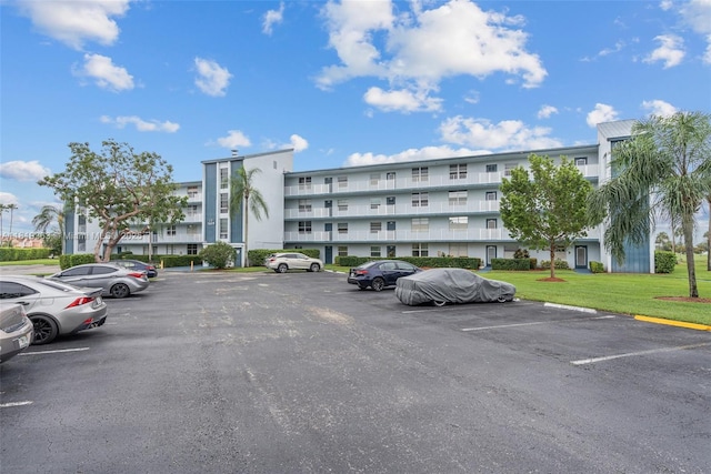 7608 NW 18th St Unit 405, Margate, FL 33063 - view of property featuring uncovered parking