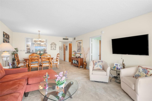 7608 NW 18th St Unit 405, Margate, FL 33063 - living room featuring a chandelier, light tile patterned floors, and a textured ceiling