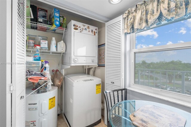 7608 NW 18th St Unit 405, Margate, FL 33063 - washroom with stacked washer / drying machine and electric water heater