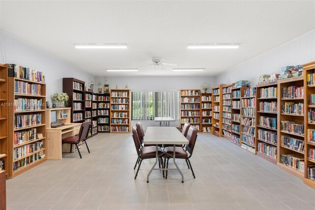 7608 NW 18th St Unit 405, Margate, FL 33063 - office area featuring wall of books and ceiling fan