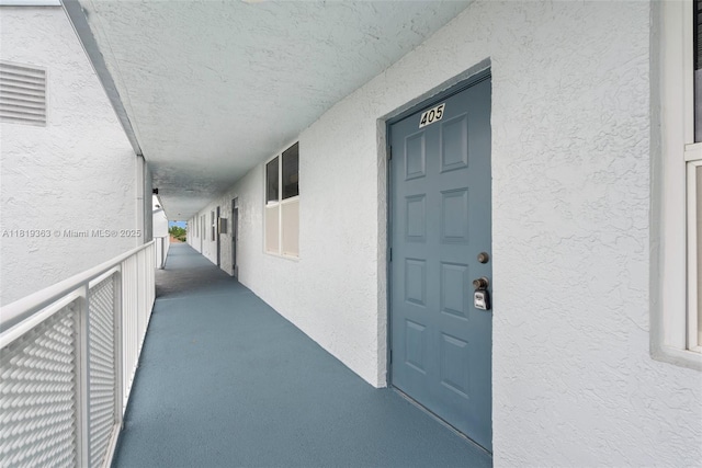 7608 NW 18th St Unit 405, Margate, FL 33063 - view of exterior entry with stucco siding