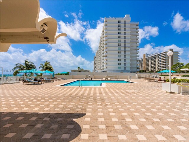 5701 Collins Ave Unit 307, Miami Beach, FL 33140 - community pool featuring a patio