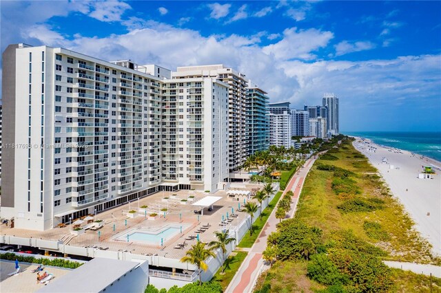 5701 Collins Ave Unit 307, Miami Beach, FL 33140 - view of apartment building / complex featuring view of water and beach and a community pool