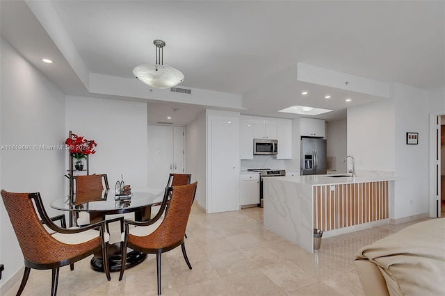 848 Brickell Key Dr Unit 1803, Miami, FL 33131 - dining area with recessed lighting and light tile patterned floors