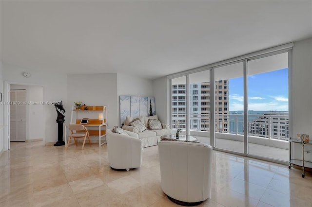 848 Brickell Key Dr Unit 1803, Miami, FL 33131 - living room with expansive windows, light tile patterned flooring, and a water view