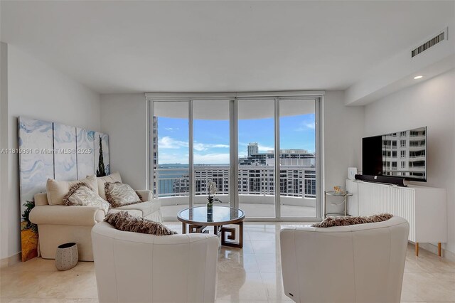 848 Brickell Key Dr Unit 1803, Miami, FL 33131 - living area with expansive windows and light tile patterned flooring