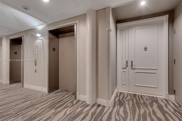 848 Brickell Key Dr Unit 1803, Miami, FL 33131 - hall with elevator, carpet flooring, and recessed lighting