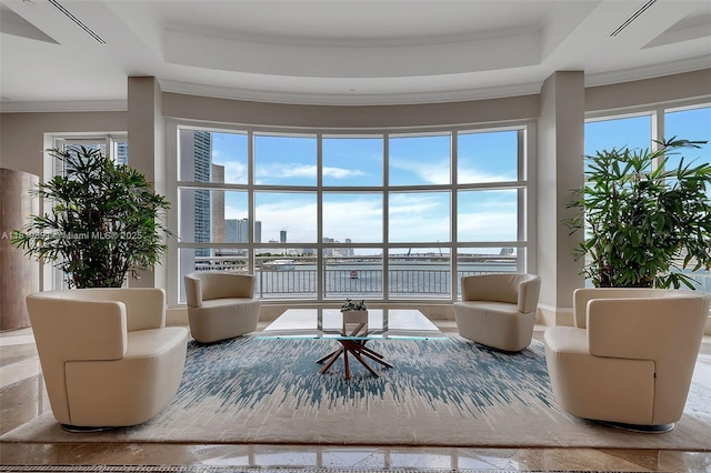 848 Brickell Key Dr Unit 1803, Miami, FL 33131 - living room featuring ornamental molding, a water view, plenty of natural light, and a raised ceiling
