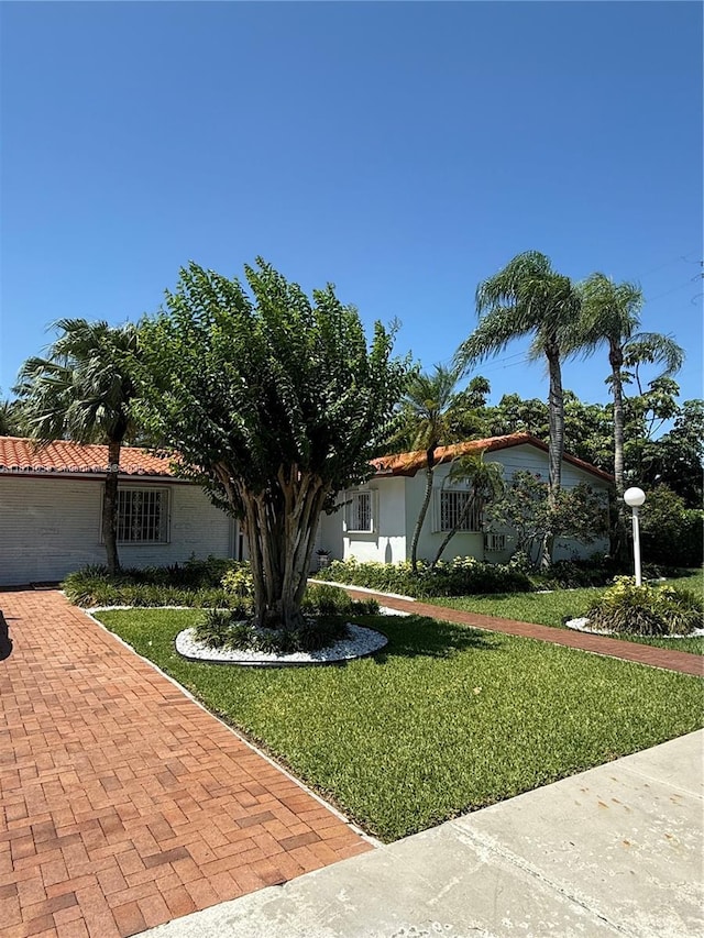 8701 SW 80th St, Miami, FL 33173 - view of front of home with a front yard