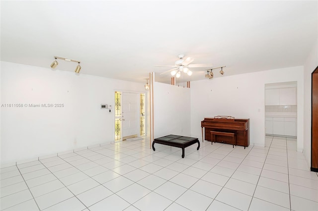 8701 SW 80th St, Miami, FL 33173 - spare room with track lighting, a ceiling fan, and light tile patterned floors