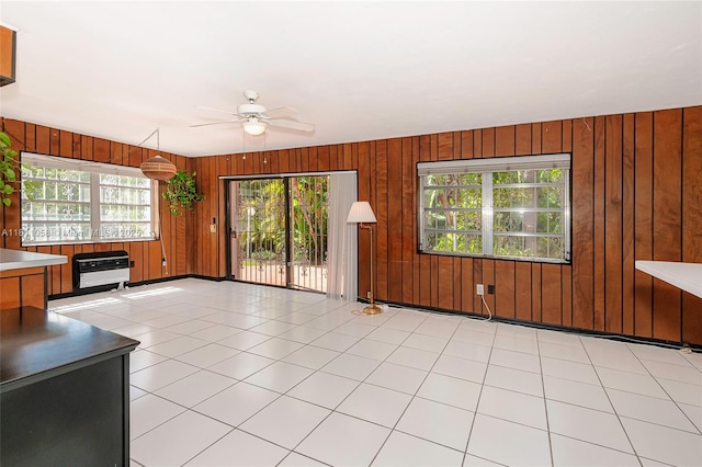 8701 SW 80th St, Miami, FL 33173 - unfurnished living room with a ceiling fan, healthy amount of natural light, and wood walls