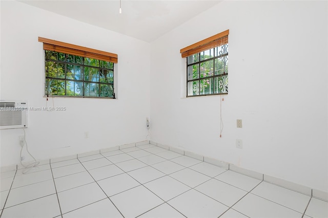 8701 SW 80th St, Miami, FL 33173 - empty room featuring light tile patterned floors and an AC wall unit