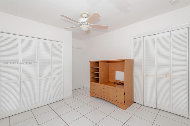 8701 SW 80th St, Miami, FL 33173 - unfurnished bedroom featuring a ceiling fan, light tile patterned floors, and a closet
