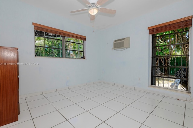 8701 SW 80th St, Miami, FL 33173 - spare room featuring a wall unit AC, a ceiling fan, and tile patterned flooring