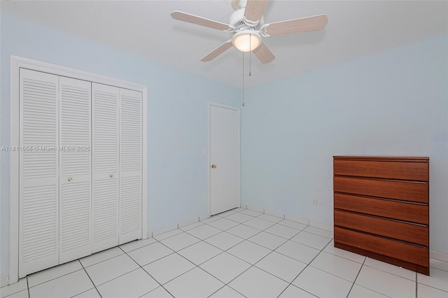 8701 SW 80th St, Miami, FL 33173 - unfurnished bedroom with light tile patterned floors, a closet, and ceiling fan