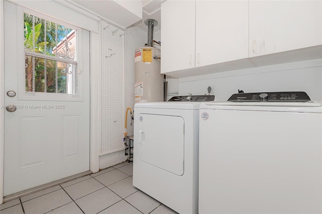 8701 SW 80th St, Miami, FL 33173 - laundry room with cabinet space, washer and clothes dryer, light tile patterned floors, and water heater