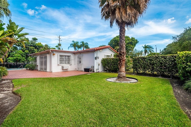 8701 SW 80th St, Miami, FL 33173 - back of property with stucco siding and a patio area