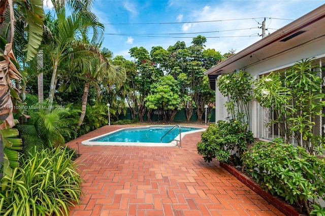 8701 SW 80th St, Miami, FL 33173 - view of swimming pool with a patio area and a fenced backyard