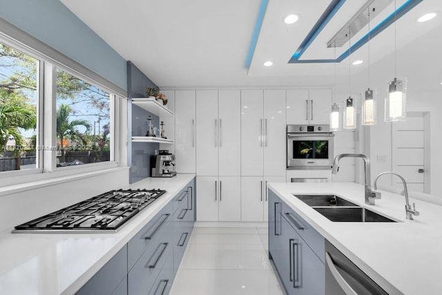 4140 N 36th Ave, Hollywood, FL 33021 - kitchen featuring stainless steel appliances, light tile patterned floors, hanging light fixtures, light countertops, and recessed lighting