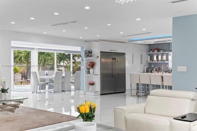 4140 N 36th Ave, Hollywood, FL 33021 - living area featuring bar with sink, light tile patterned floors, and recessed lighting
