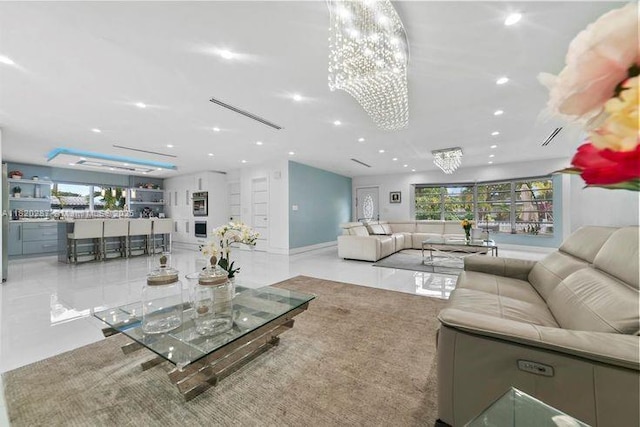 4140 N 36th Ave, Hollywood, FL 33021 - living room with recessed lighting, a chandelier, tile patterned floors, and healthy amount of natural light