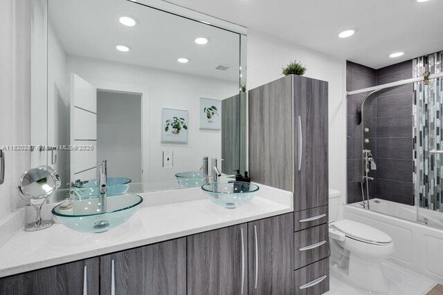 4140 N 36th Ave, Hollywood, FL 33021 - full bathroom featuring double vanity, recessed lighting, and bath / shower combo with glass door